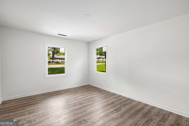 6932 Eunice Dr, Riverdale, GA 30274 - empty room with wood finished floors and baseboards