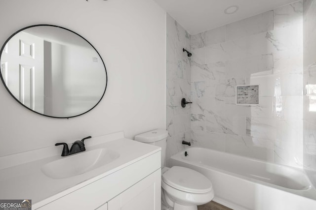 6932 Eunice Dr, Riverdale, GA 30274 - bathroom featuring toilet, vanity, and bathing tub / shower combination