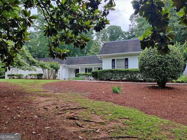 7640 Ryefield Dr, Sandy Springs, GA 30350 - view of front of house featuring mansard roof and a shingled roof