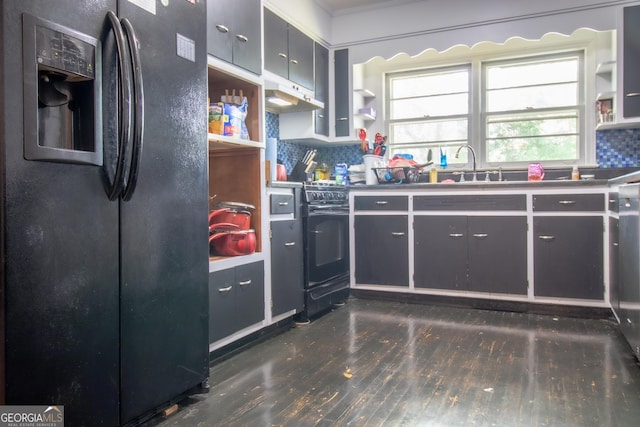 kitchen with black appliances, dark wood-type flooring, open shelves, ornamental molding, and under cabinet range hood