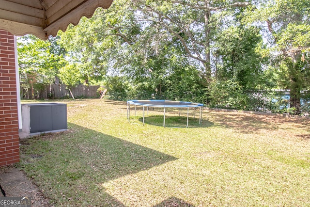view of yard with a trampoline