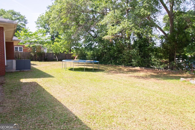 view of yard featuring a trampoline