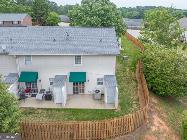 2866 Florence Dr, Gainesville, GA 30504 - back of house featuring a patio, central air condition unit, and a shingled roof