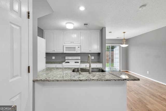 2866 Florence Dr, Gainesville, GA 30504 - kitchen featuring white appliances, a sink, white cabinets, a textured ceiling, and light wood finished floors