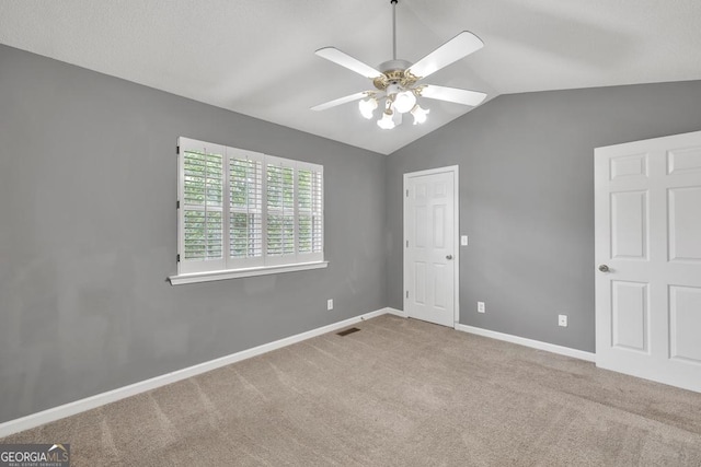 2866 Florence Dr, Gainesville, GA 30504 - unfurnished bedroom with lofted ceiling, carpet floors, baseboards, and a ceiling fan