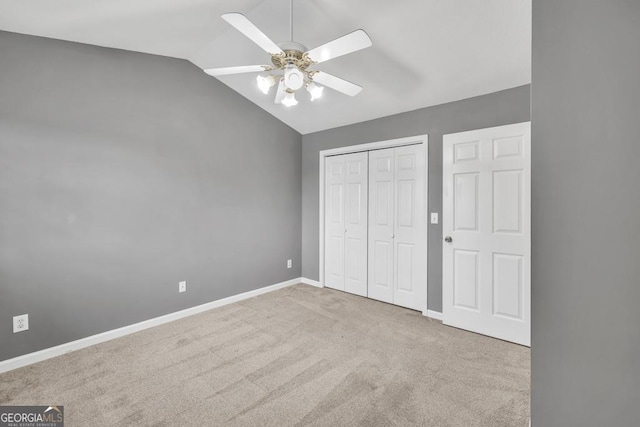 2866 Florence Dr, Gainesville, GA 30504 - unfurnished bedroom with carpet, vaulted ceiling, a closet, baseboards, and ceiling fan