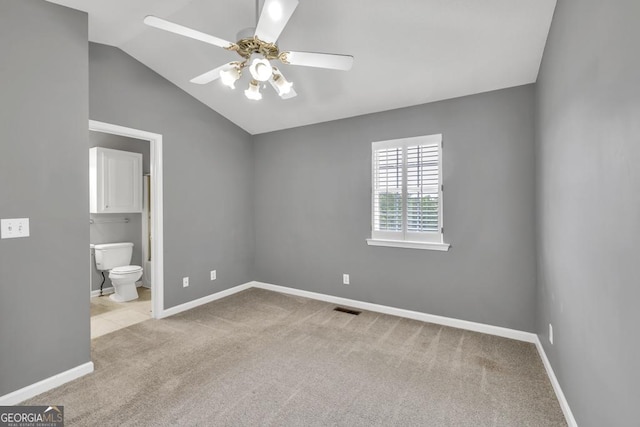 2866 Florence Dr, Gainesville, GA 30504 - unfurnished bedroom featuring carpet flooring, baseboards, vaulted ceiling, connected bathroom, and a ceiling fan