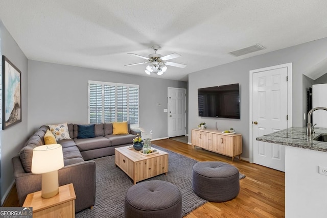 2866 Florence Dr, Gainesville, GA 30504 - living room with wood finished floors, ceiling fan, and baseboards