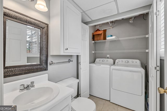 2866 Florence Dr, Gainesville, GA 30504 - bathroom featuring washing machine and dryer, toilet, tile patterned floors, and vanity