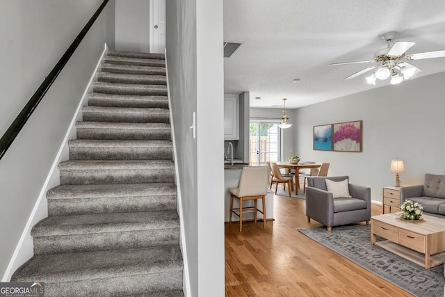 2866 Florence Dr, Gainesville, GA 30504 - staircase featuring wood finished floors and ceiling fan