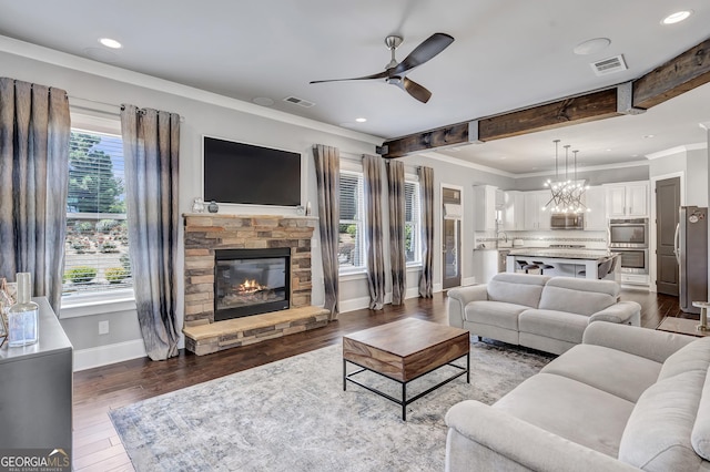 3179 Falls Crest Ct, Buford, GA 30519 - living area featuring a ceiling fan, ornamental molding, a fireplace, dark wood finished floors, and recessed lighting