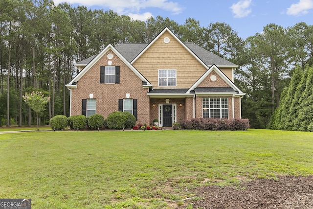 3 Tiffany Trce, Palmetto, GA 30268 - view of front of home with a front yard, a shingled roof, and brick siding