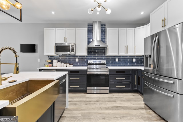 3 Tiffany Trce, Palmetto, GA 30268 - kitchen featuring appliances with stainless steel finishes, wall chimney range hood, white cabinetry, light countertops, and recessed lighting