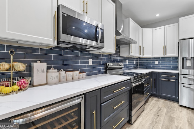 3 Tiffany Trce, Palmetto, GA 30268 - kitchen featuring stainless steel appliances, wall chimney exhaust hood, wine cooler, white cabinets, and recessed lighting