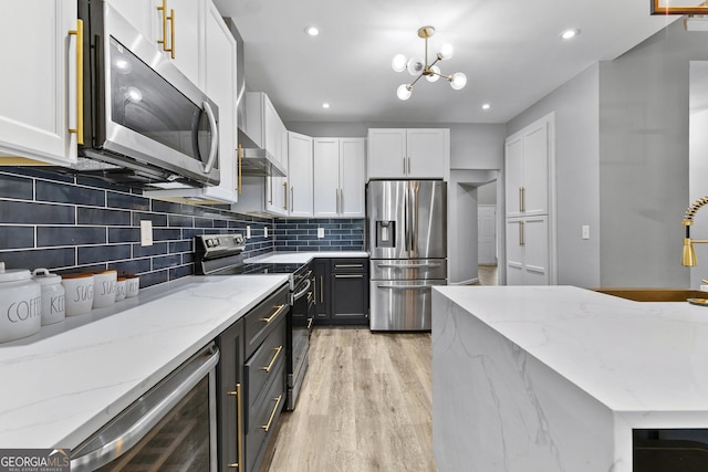 3 Tiffany Trce, Palmetto, GA 30268 - kitchen featuring stainless steel appliances, white cabinets, beverage cooler, decorative backsplash, and light wood finished floors