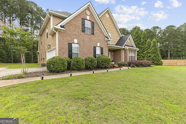 3 Tiffany Trce, Palmetto, GA 30268 - traditional-style house with a front yard, brick siding, a garage, and driveway