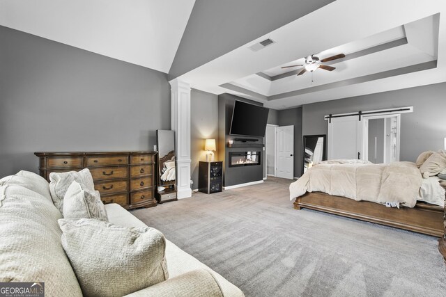 3 Tiffany Trce, Palmetto, GA 30268 - bedroom featuring carpet floors, a tray ceiling, a barn door, a ceiling fan, and decorative columns