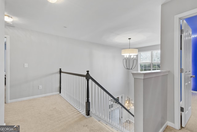 3 Tiffany Trce, Palmetto, GA 30268 - hallway featuring an upstairs landing, carpet flooring, and a chandelier