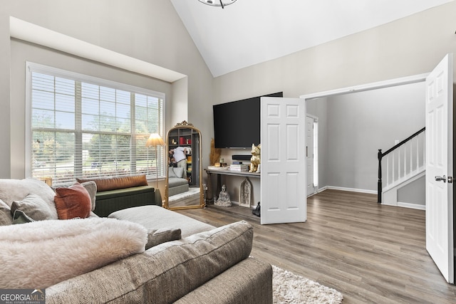 3 Tiffany Trce, Palmetto, GA 30268 - living area featuring high vaulted ceiling, wood finished floors, and stairs