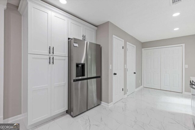 3216 Montheath Ct, Duluth, GA 30096 - kitchen with stainless steel fridge, baseboards, light marble finish floors, white cabinetry, and recessed lighting