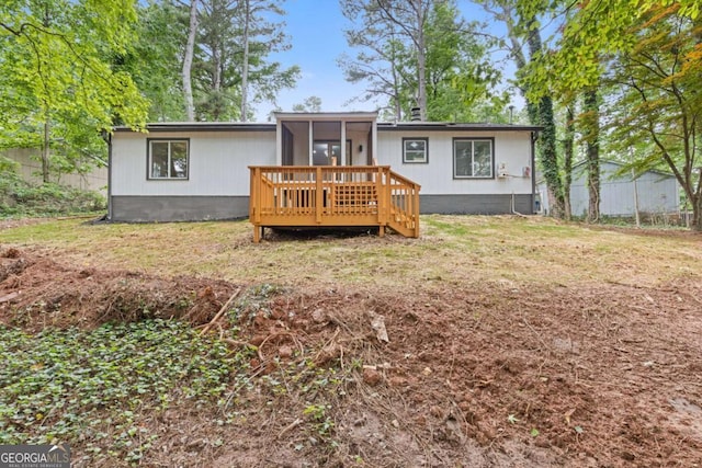 3216 Montheath Ct, Duluth, GA 30096 - back of house with a sunroom and a deck