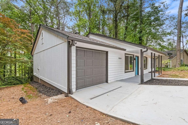 3216 Montheath Ct, Duluth, GA 30096 - ranch-style house featuring a garage and covered porch
