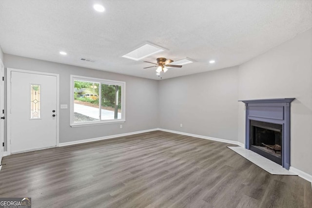 3216 Montheath Ct, Duluth, GA 30096 - unfurnished living room with a fireplace, wood finished floors, recessed lighting, baseboards, and a ceiling fan