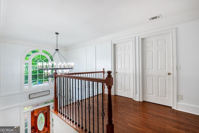 1000 Admiral Xing, Alpharetta, GA 30005 - hallway with a chandelier, dark wood finished floors, an upstairs landing, crown molding, and baseboards