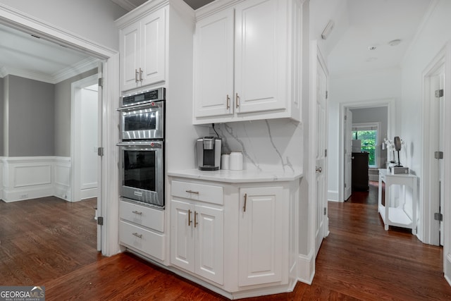 1000 Admiral Xing, Alpharetta, GA 30005 - kitchen with double oven, crown molding, white cabinets, dark wood-style flooring, and backsplash