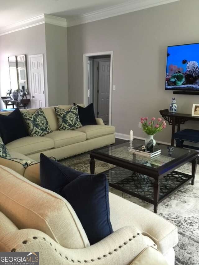 1305 Lake Forest Ln, Mcdonough, GA 30253 - living area with ornamental molding and baseboards