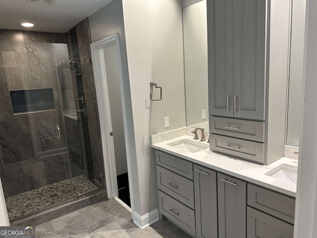 1305 Lake Forest Ln, Mcdonough, GA 30253 - full bathroom with double vanity, a shower stall, marble finish floors, and baseboards
