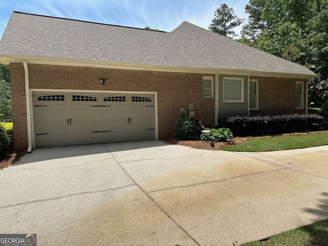 1305 Lake Forest Ln, Mcdonough, GA 30253 - view of front of property with brick siding, a shingled roof, and a garage