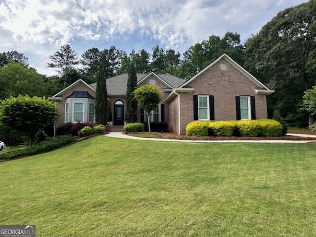 1305 Lake Forest Ln, Mcdonough, GA 30253 - ranch-style home featuring a front lawn and brick siding