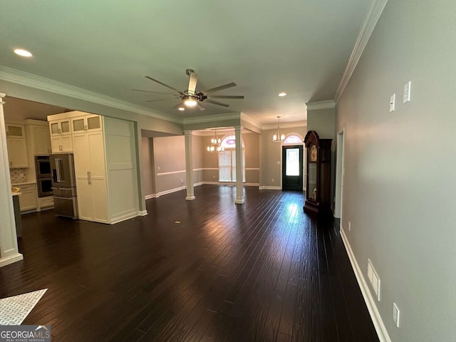 1305 Lake Forest Ln, Mcdonough, GA 30253 - unfurnished living room with a chandelier, a ceiling fan, dark wood-type flooring, decorative columns, and baseboards