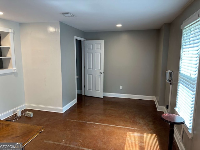1305 Lake Forest Ln, Mcdonough, GA 30253 - spare room featuring baseboards, plenty of natural light, finished concrete flooring, and recessed lighting
