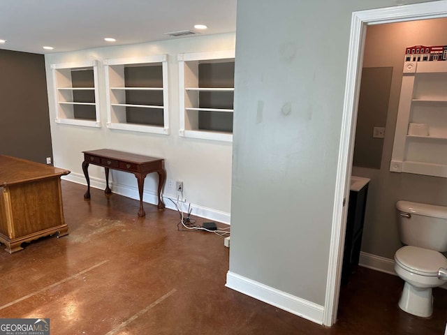 1305 Lake Forest Ln, Mcdonough, GA 30253 - unfurnished office with baseboards, concrete flooring, built in shelves, and recessed lighting