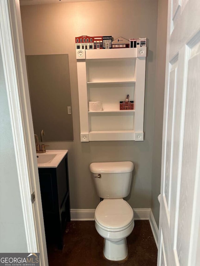 1305 Lake Forest Ln, Mcdonough, GA 30253 - half bathroom with baseboards, toilet, and vanity