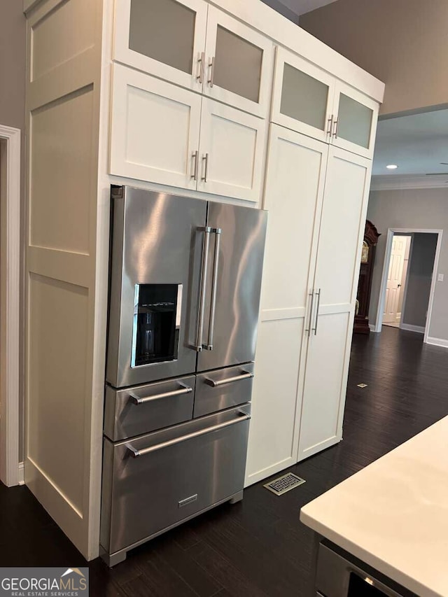 1305 Lake Forest Ln, Mcdonough, GA 30253 - kitchen featuring high quality fridge, dark wood-style flooring, light countertops, white cabinetry, and recessed lighting