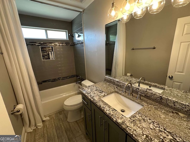 1305 Lake Forest Ln, Mcdonough, GA 30253 - bathroom with shower / bath combo, toilet, vanity, and wood finished floors