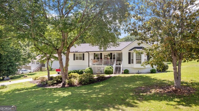 2675 Springside Ct, Douglasville, GA 30135 - ranch-style home with stairway, a front yard, a porch, and roof with shingles