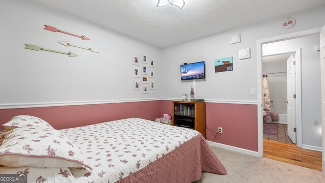 2675 Springside Ct, Douglasville, GA 30135 - bedroom featuring carpet floors, a textured ceiling, and baseboards