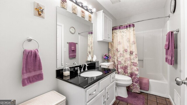 2675 Springside Ct, Douglasville, GA 30135 - full bath featuring toilet, vanity, tile patterned flooring, and shower / tub combo with curtain