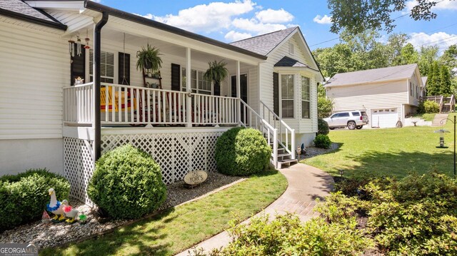 2675 Springside Ct, Douglasville, GA 30135 - view of front facade with a porch, a front lawn, roof with shingles, and stairway
