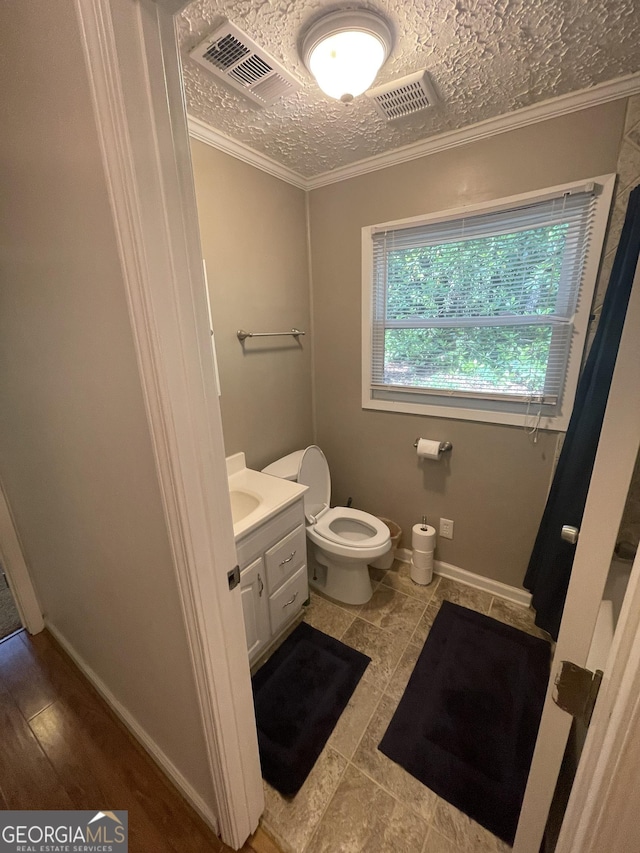 101 Brookridge Dr, Hogansville, GA 30230 - bathroom with toilet, vanity, baseboards, and crown molding