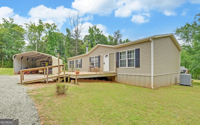 484 Tb Thornton Dr, Hartwell, GA 30643 - back of property featuring a carport, a lawn, a deck, cooling unit, and driveway