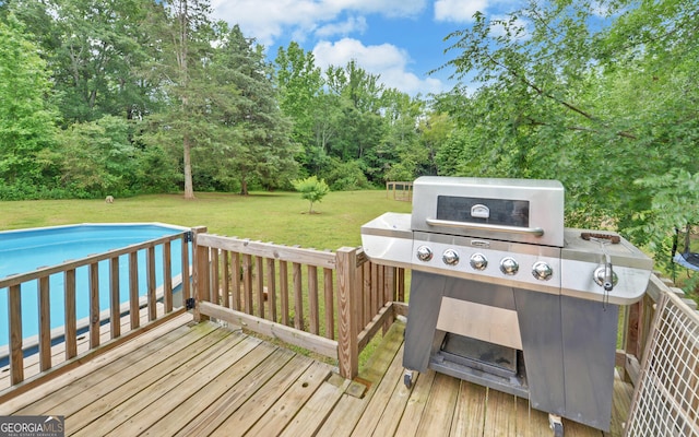 484 Tb Thornton Dr, Hartwell, GA 30643 - wooden deck with area for grilling, a yard, and an outdoor pool