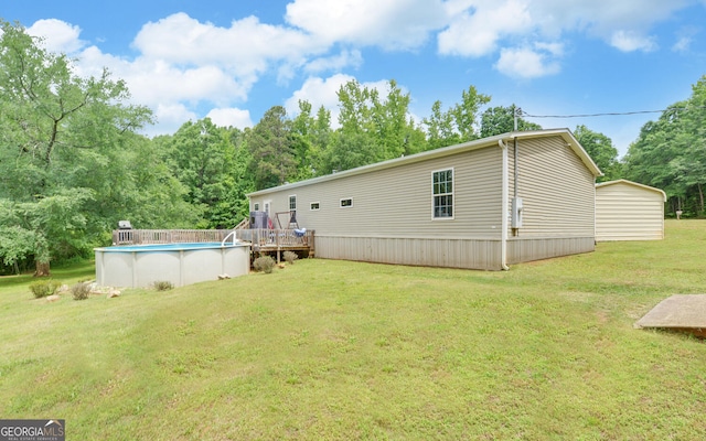 484 Tb Thornton Dr, Hartwell, GA 30643 - back of house featuring a yard, a deck, and an outdoor pool