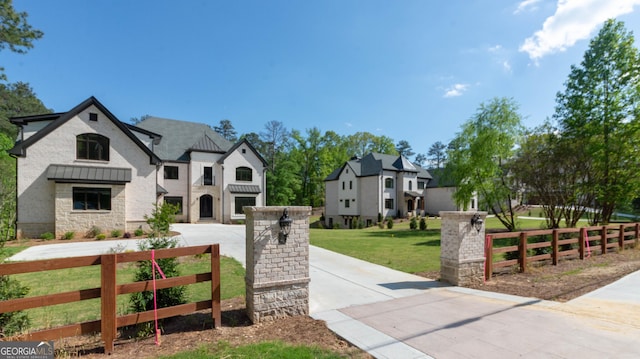 10765 Shallowford Rd, Roswell, GA 30075 - view of front of house with driveway, stone siding, and a standing seam roof