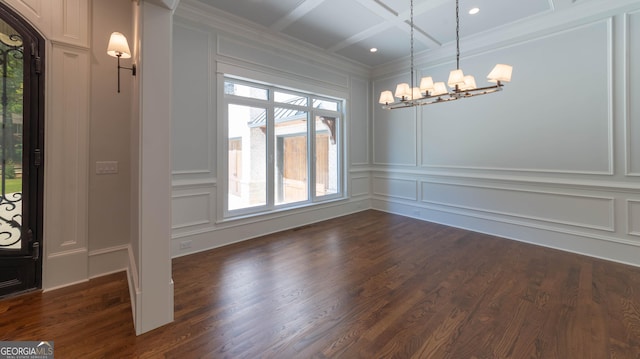 10765 Shallowford Rd, Roswell, GA 30075 - unfurnished dining area featuring a decorative wall, a chandelier, dark wood-type flooring, coffered ceiling, and crown molding