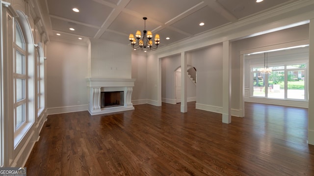 10765 Shallowford Rd, Roswell, GA 30075 - unfurnished living room featuring a chandelier, coffered ceiling, crown molding, arched walkways, and dark wood finished floors